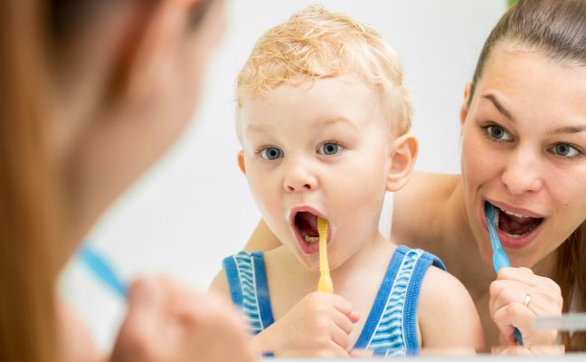 Mother and son brushing0