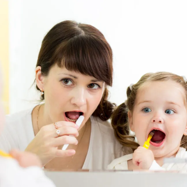 mother and daughter brushing0