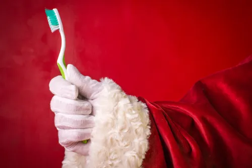 Smiles Dental, Santa holding a toothbrush